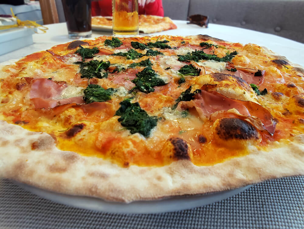 Pizza with Speck in South Tyrol