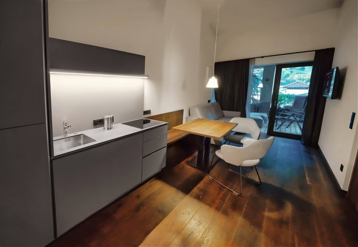 Aquila Dolomites Residence: Ortisei Below, the Dolomites Beyond, and You in Between 7 A penthouse kitchen at the Aquila Dolomites Residence in Ortisei.