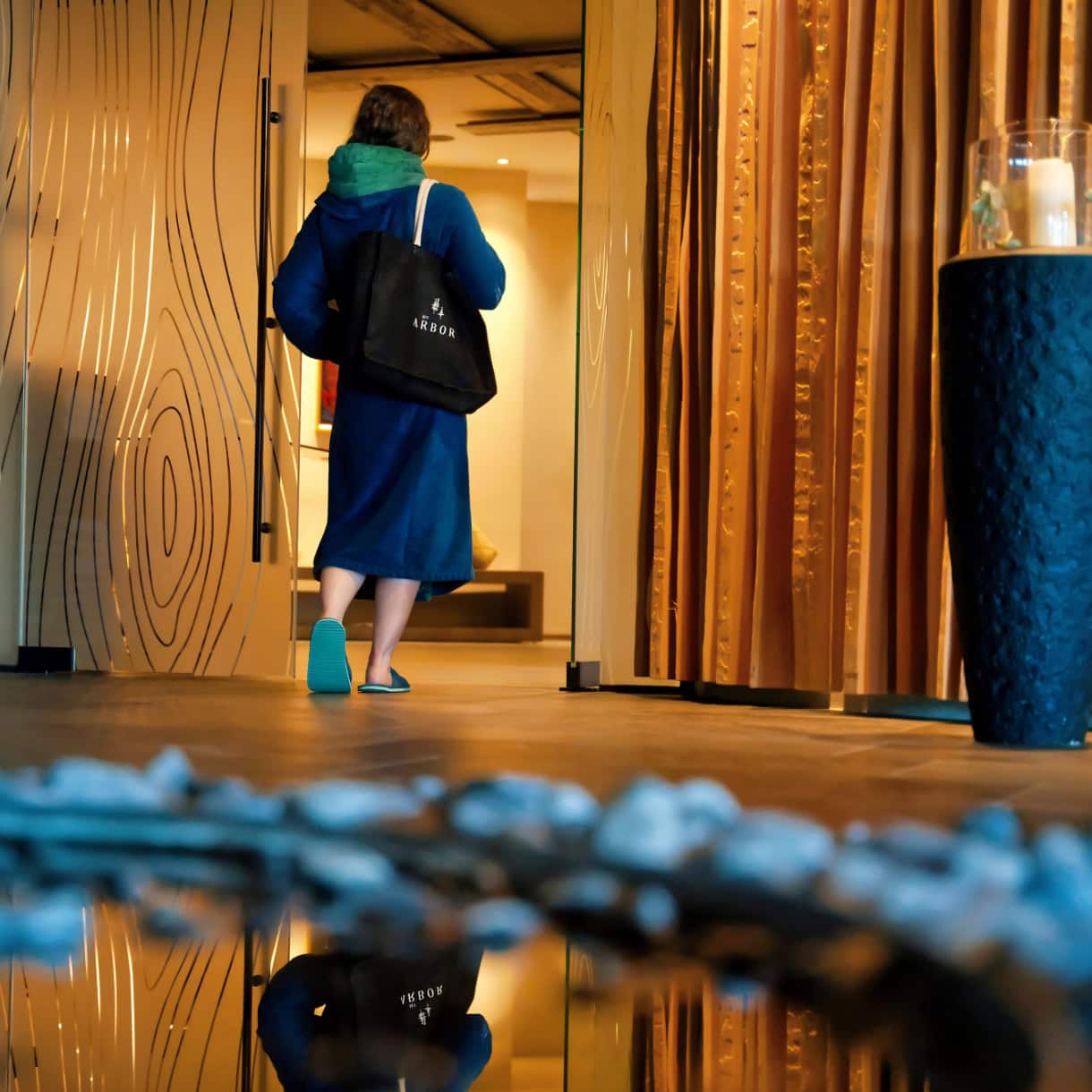 A woman walking into the spa at My Arnor. 