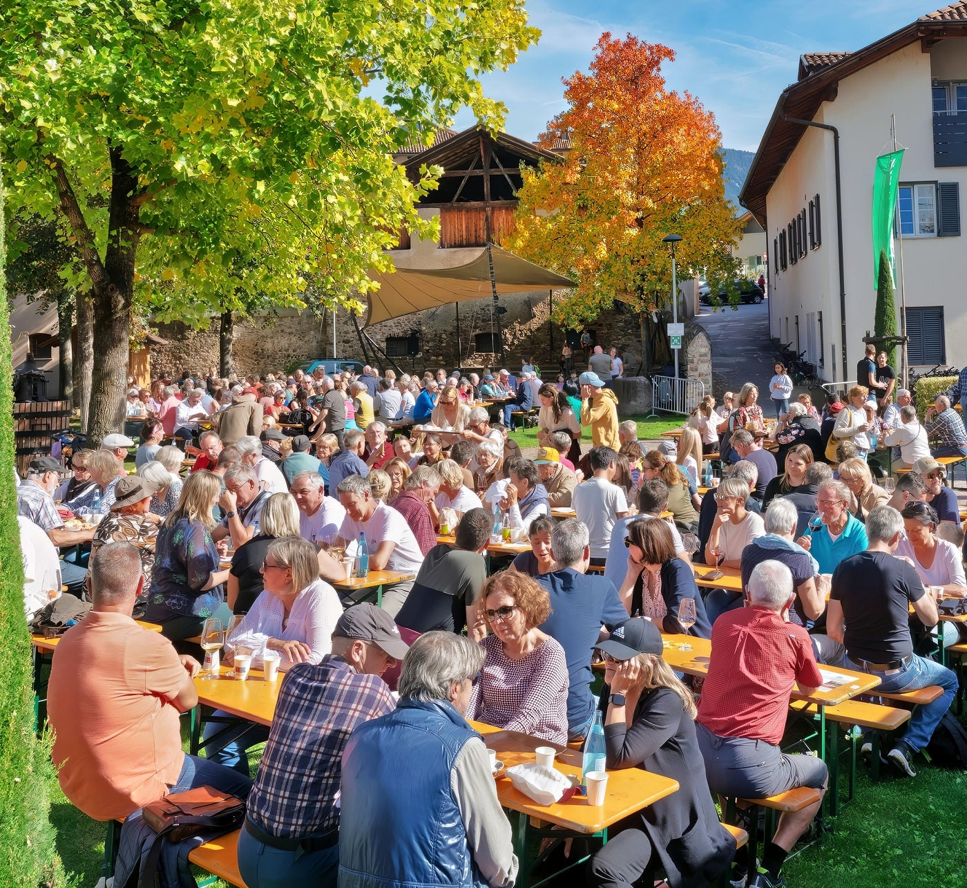 From Vine to Village: Raise a Glass at South Tyrol's Last Load of Grapes Festival 4 Festival goers at the Last Load of Grapes Festival in Girlan, South Tyrol.