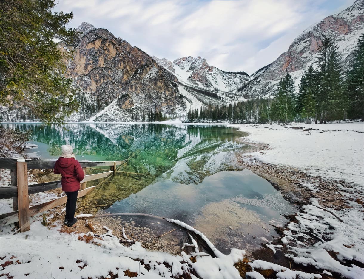 Beyond the Peaks: 12 Must-See Lakes in South Tyrol and the Dolomites 2 lago di braies winter snow hiker dolomites lake