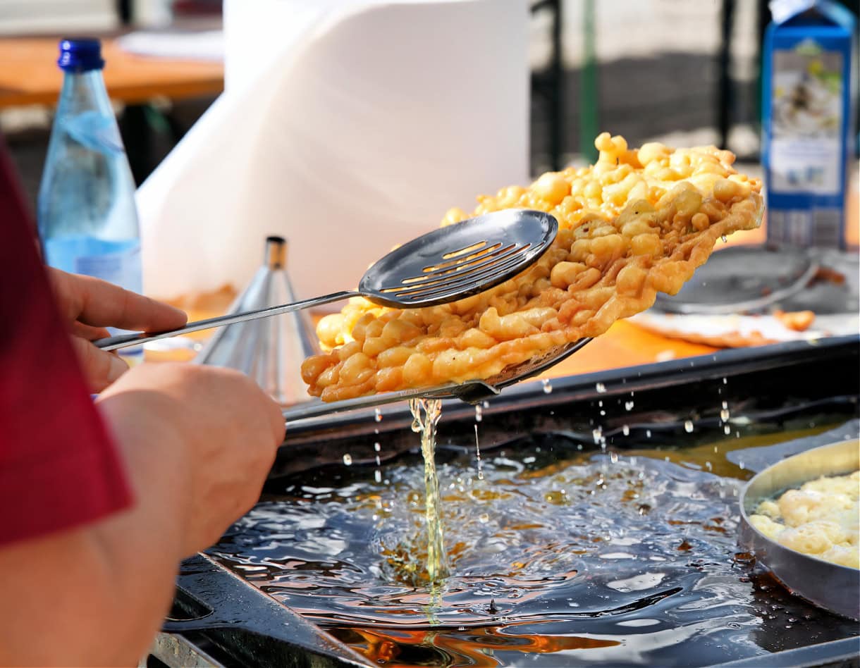 Sweet Summit: 8 Must-Try Desserts in South Tyrol & the Dolomites 10 Strauben being made in the Dolomites.