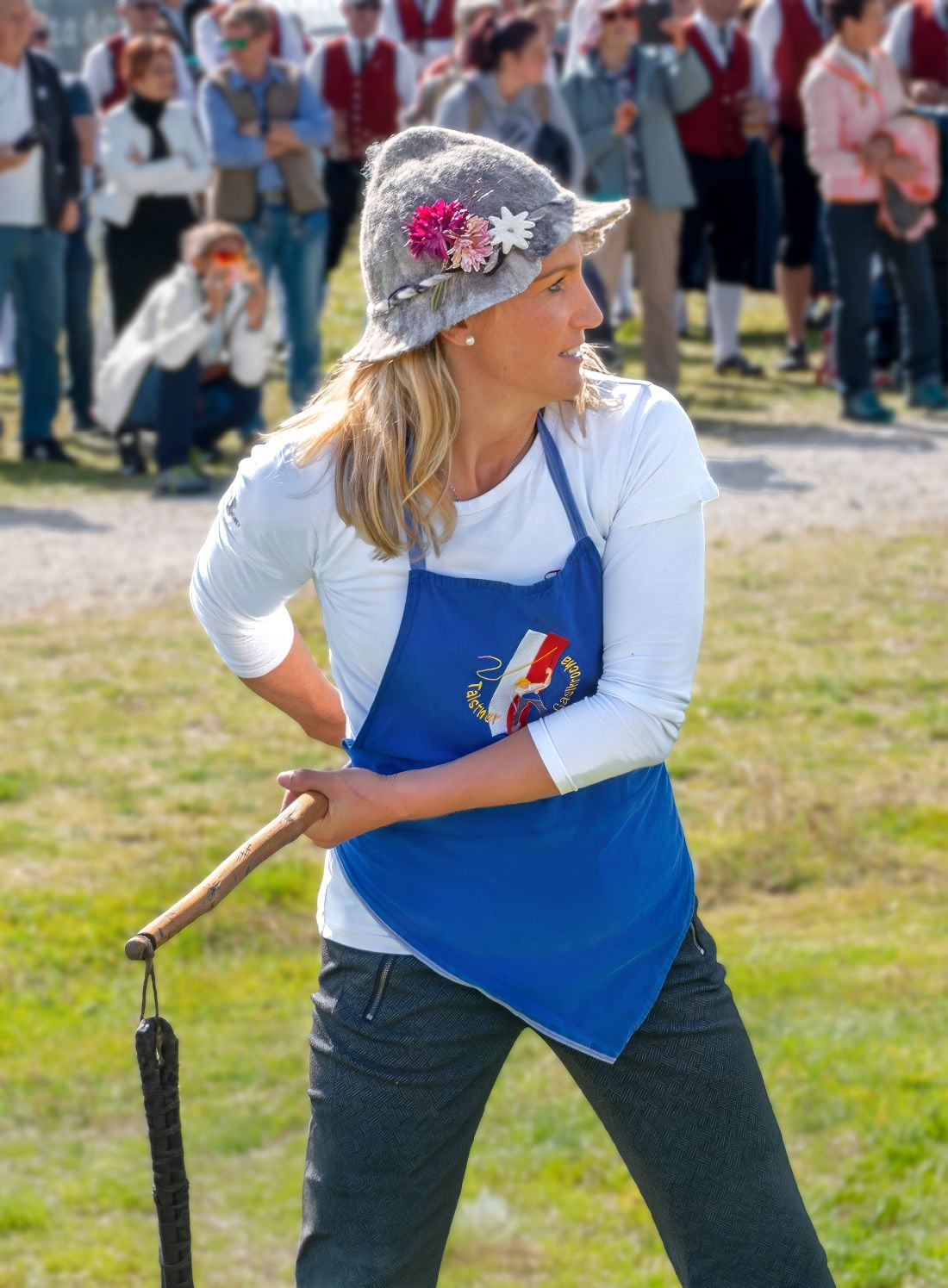 A woman Goaslschnöller getting ready to crack her whip at Speckfest.