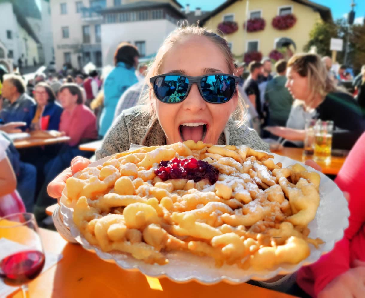 Sweet Summit: 8 Must-Try Desserts in South Tyrol & the Dolomites 9 A plate of Strauben at a festival in South Tyrol.