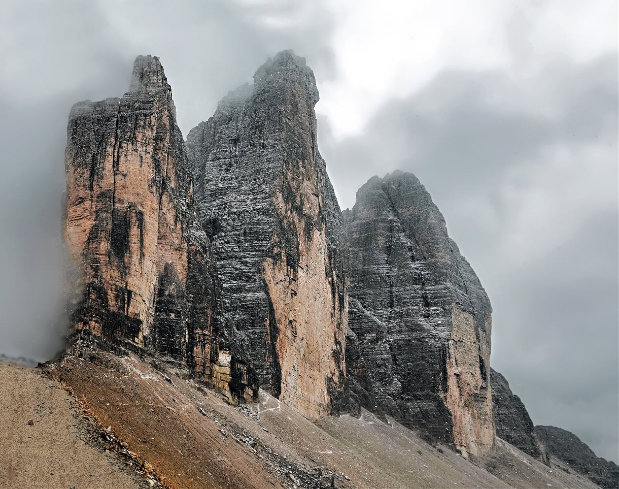 A close up view of Tre Cime di Lavaredo on a cloudy day.